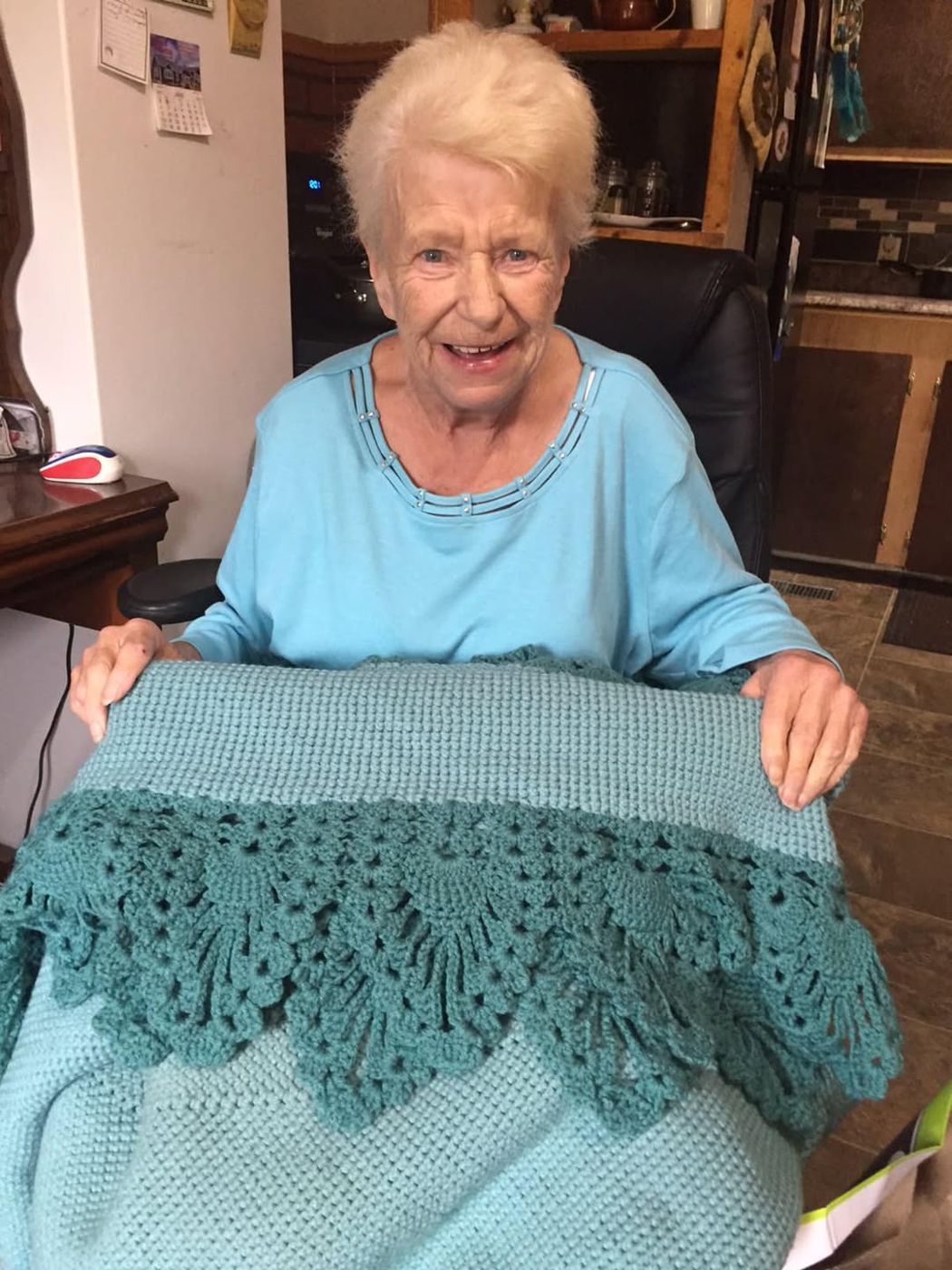 Mary Hebert, with an afghan made by Jane MacDonald of East Point