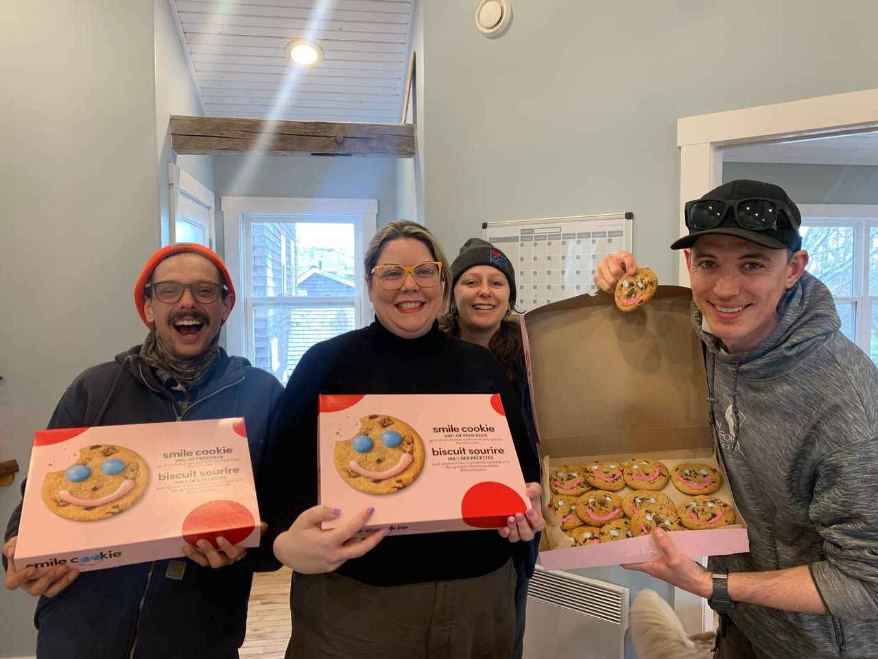 Smile Cookie supporters showing off their boxes of cookies