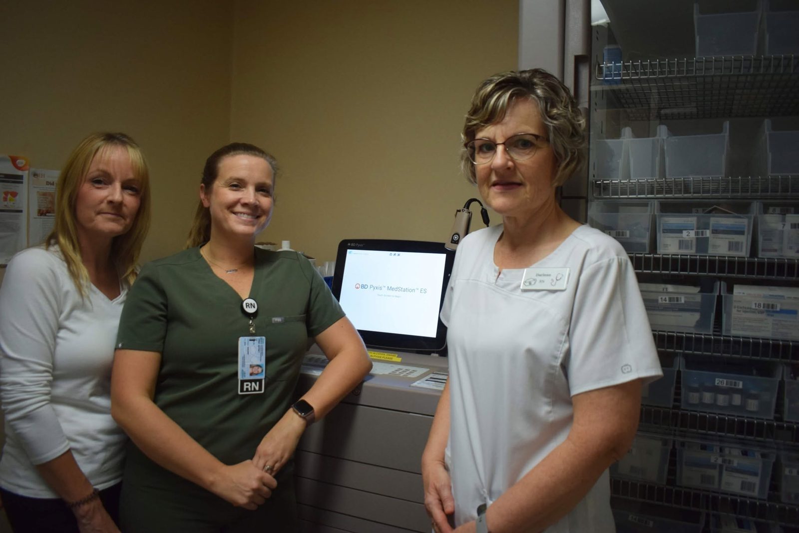 Lori Jones with RN Sheri Jeffrey and Darlene MacNeill Veld beside the Pyxis MedStation