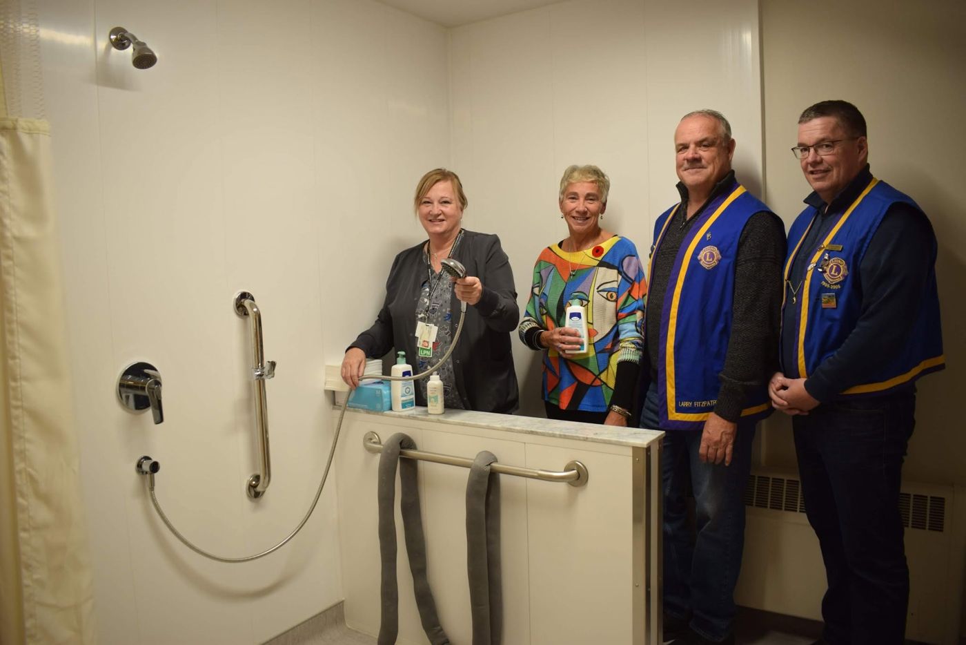 LPN Anne Dunphy with Lions and EKHF members in the new shower room